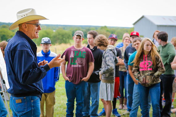 MU Extension staff member talking with group of rural kids